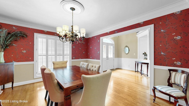 17217 Mallet Hill Dr, Louisville, KY 40245 - dining space featuring wallpapered walls, a chandelier, light wood finished floors, and ornamental molding