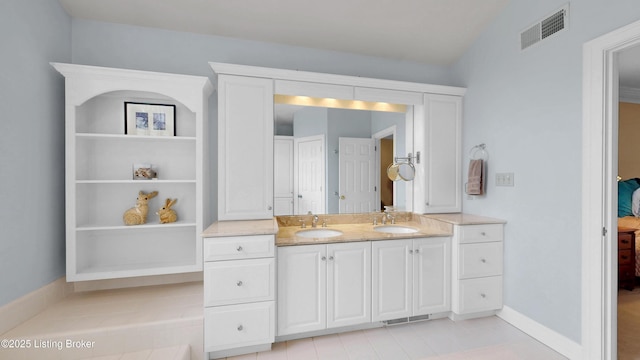 17217 Mallet Hill Dr, Louisville, KY 40245 - ensuite bathroom with double vanity and baseboards