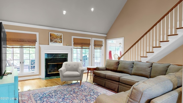 17217 Mallet Hill Dr, Louisville, KY 40245 - living area featuring healthy amount of natural light, a fireplace, wood finished floors, high vaulted ceiling, and recessed lighting