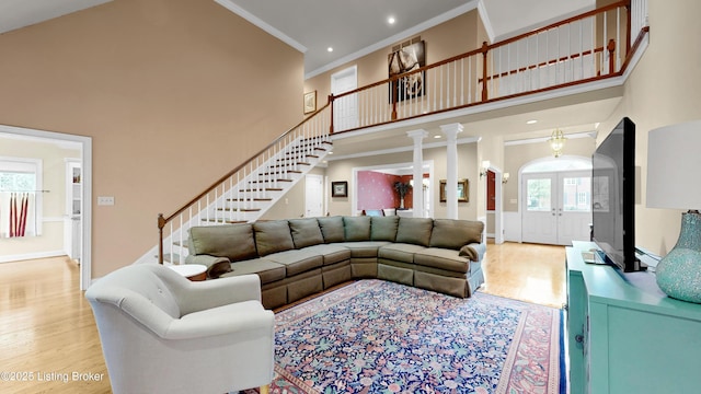 17217 Mallet Hill Dr, Louisville, KY 40245 - living room with stairs, french doors, wood finished floors, crown molding, and a towering ceiling
