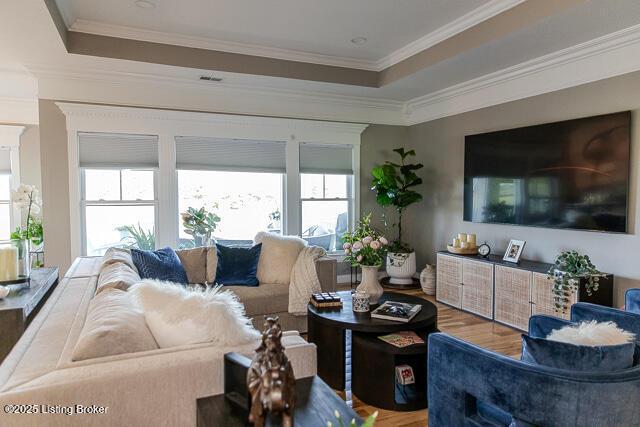 2370 N Borcherding Rd, Madison, IN 47250 - living room with wood finished floors, a raised ceiling, and crown molding