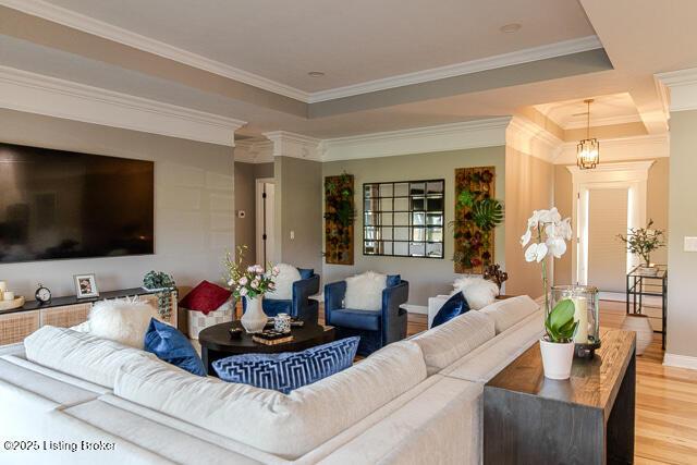 2370 N Borcherding Rd, Madison, IN 47250 - living room with wood finished floors, crown molding, and a raised ceiling