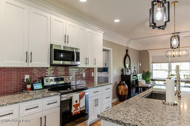 2370 N Borcherding Rd, Madison, IN 47250 - kitchen with stainless steel appliances, backsplash, white cabinets, light stone counters, and pendant lighting