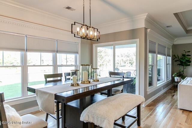 2370 N Borcherding Rd, Madison, IN 47250 - dining room featuring light wood-style flooring, ornamental molding, and a chandelier