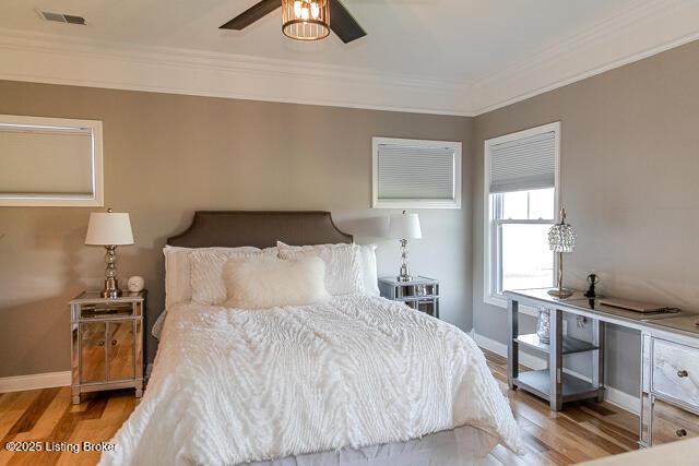 2370 N Borcherding Rd, Madison, IN 47250 - bedroom featuring wood finished floors, crown molding, and ceiling fan
