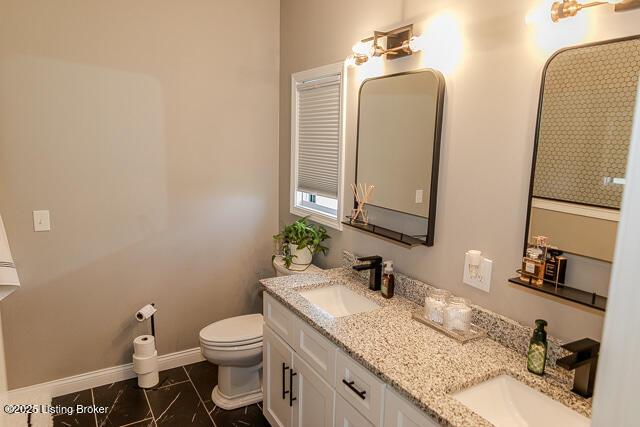 2370 N Borcherding Rd, Madison, IN 47250 - full bathroom featuring double vanity and toilet