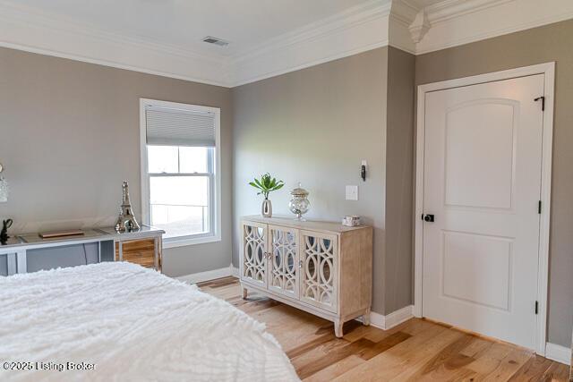 2370 N Borcherding Rd, Madison, IN 47250 - bedroom with ornamental molding and light wood-style flooring