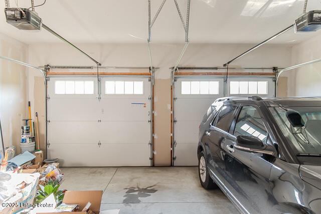 2370 N Borcherding Rd, Madison, IN 47250 - garage featuring a garage door opener