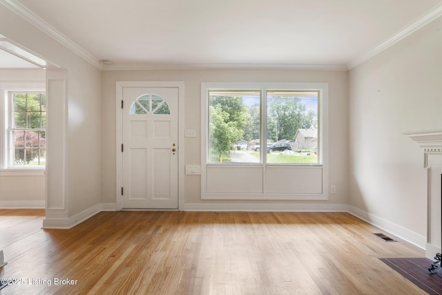 1669 Trigg St, Louisville, KY 40213 - foyer with light wood-style flooring and crown molding