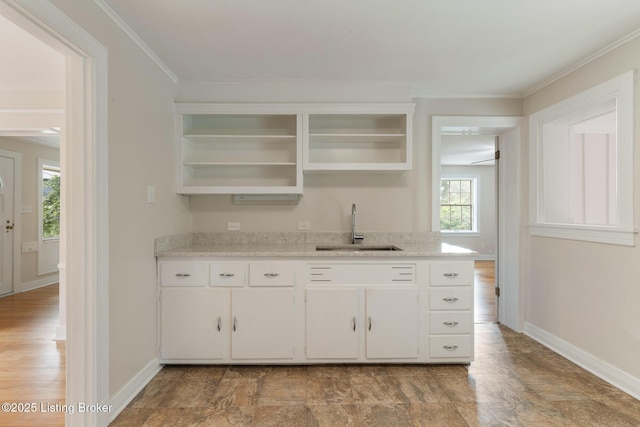 1669 Trigg St, Louisville, KY 40213 - bar with plenty of natural light and crown molding