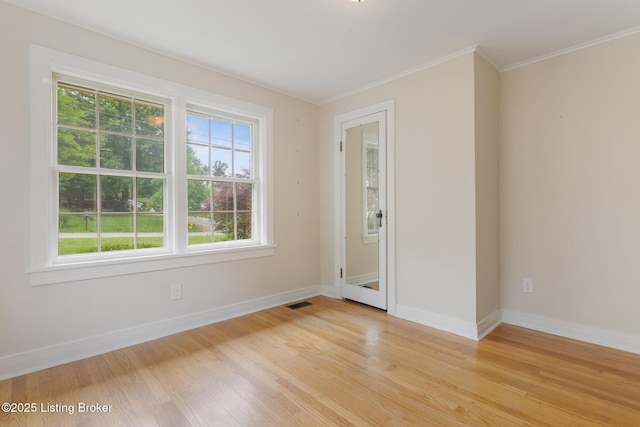 1669 Trigg St, Louisville, KY 40213 - unfurnished room featuring light wood-style flooring and crown molding