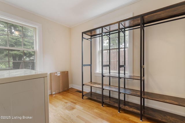 1669 Trigg St, Louisville, KY 40213 - unfurnished bedroom featuring washer / dryer and light wood finished floors