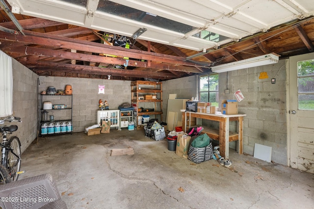 1669 Trigg St, Louisville, KY 40213 - garage with a workshop area and concrete block wall