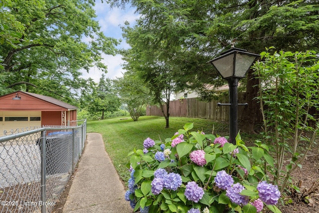 1669 Trigg St, Louisville, KY 40213 - view of yard featuring an outbuilding and a garage
