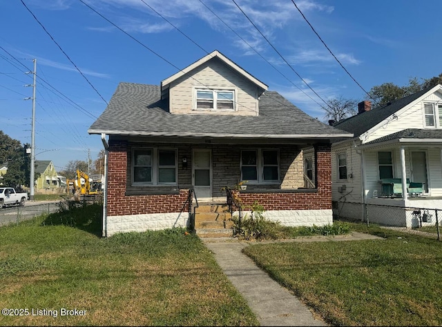 941 Demark St, Louisville, KY 40215 - bungalow-style home with a porch and brick siding