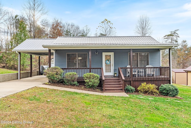 2773 Martin Pierce Rd, Cub Run, KY 42729 - view of front of house featuring driveway, a porch, a carport, and a metal roof