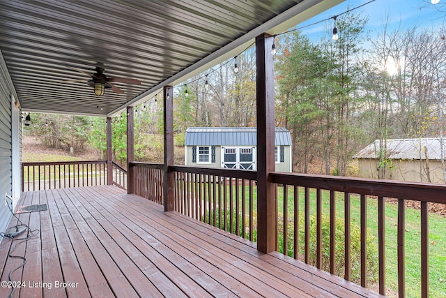2773 Martin Pierce Rd, Cub Run, KY 42729 - wooden deck featuring a ceiling fan, a storage shed, and a lawn