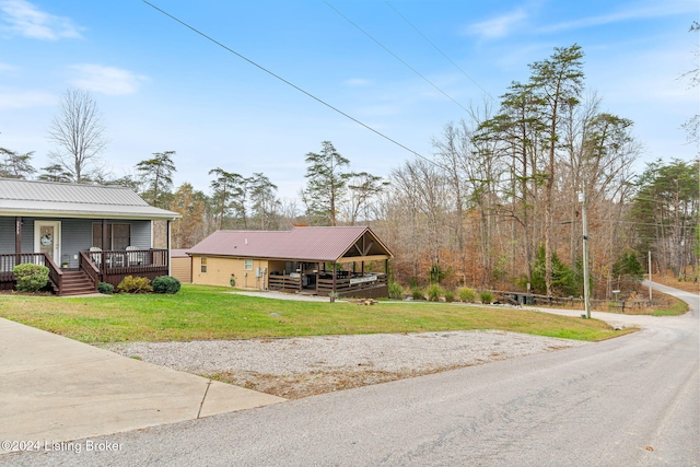 2773 Martin Pierce Rd, Cub Run, KY 42729 - view of front facade featuring a porch, a metal roof, and a front lawn