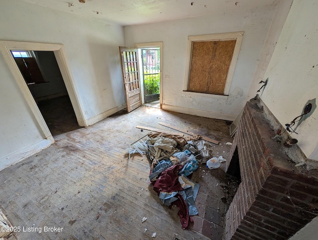 716 Cedar Grove Ct, Louisville, KY 40212 - unfurnished living room featuring baseboards and wood finished floors