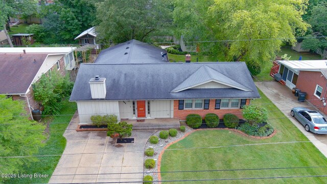 107 Westwood Dr, Elizabethtown, KY 42701 - view of front facade with a porch, a front lawn, brick siding, and roof with shingles