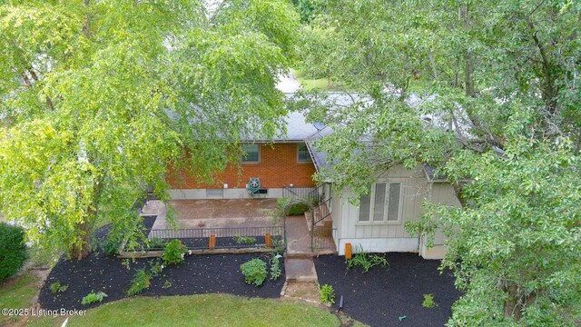 107 Westwood Dr, Elizabethtown, KY 42701 - back of house featuring stairs and brick siding