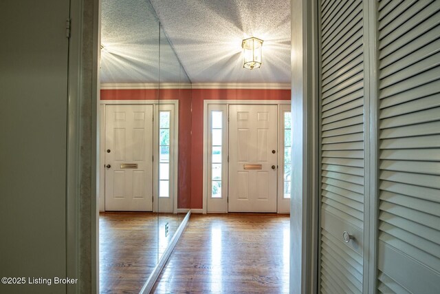 107 Westwood Dr, Elizabethtown, KY 42701 - foyer entrance featuring wood finished floors, a textured ceiling, and crown molding