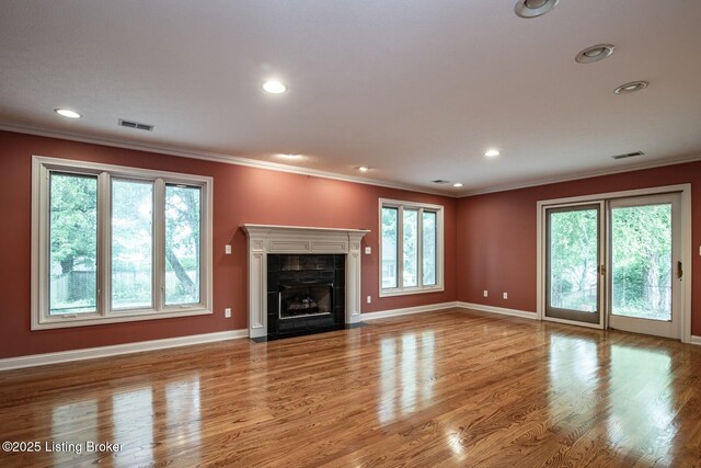 107 Westwood Dr, Elizabethtown, KY 42701 - unfurnished living room featuring crown molding, wood finished floors, a tile fireplace, and recessed lighting