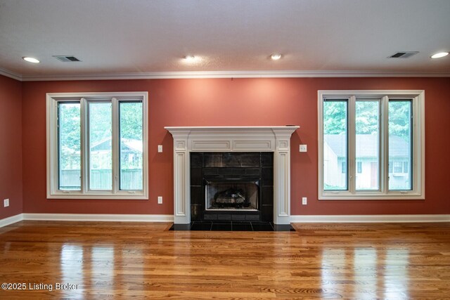 107 Westwood Dr, Elizabethtown, KY 42701 - unfurnished living room with healthy amount of natural light, wood finished floors, crown molding, recessed lighting, and a fireplace