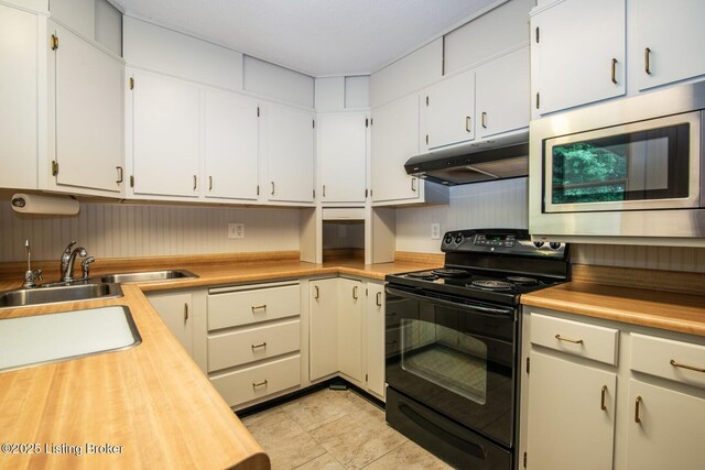 107 Westwood Dr, Elizabethtown, KY 42701 - kitchen featuring black range with electric stovetop, under cabinet range hood, stainless steel microwave, white cabinets, and wood counters