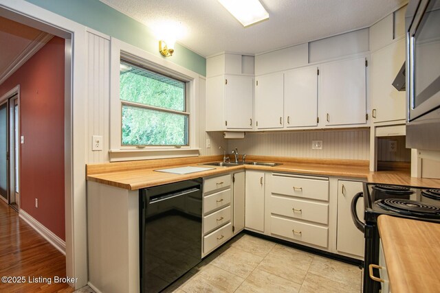 107 Westwood Dr, Elizabethtown, KY 42701 - kitchen with black appliances, wooden counters, white cabinetry, and ornamental molding