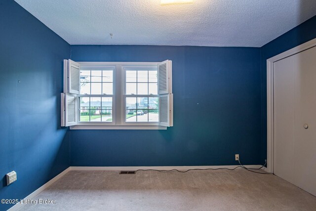 107 Westwood Dr, Elizabethtown, KY 42701 - carpeted empty room with a textured ceiling and baseboards