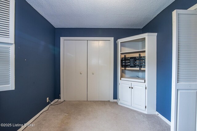 107 Westwood Dr, Elizabethtown, KY 42701 - unfurnished bedroom with carpet floors, a textured ceiling, and a closet