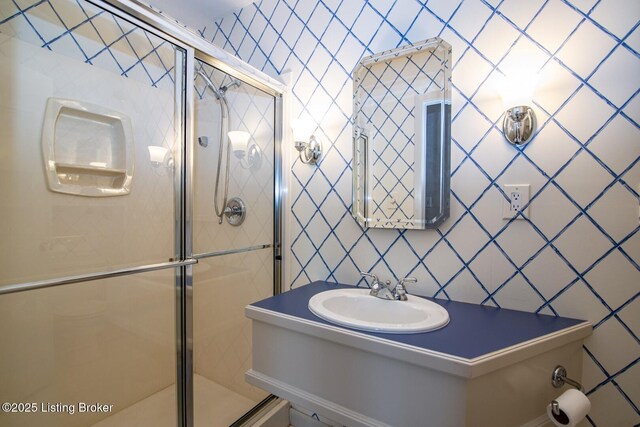 107 Westwood Dr, Elizabethtown, KY 42701 - bathroom with a shower stall, vanity, and backsplash
