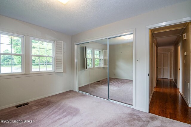 107 Westwood Dr, Elizabethtown, KY 42701 - unfurnished bedroom featuring carpet flooring, attic access, a closet, and a textured ceiling