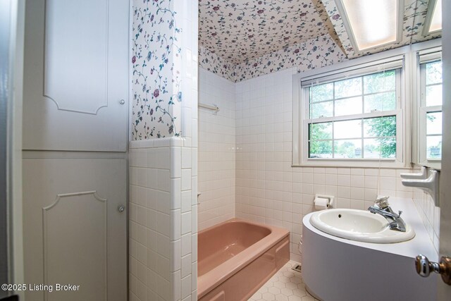 107 Westwood Dr, Elizabethtown, KY 42701 - full bath with tile walls, tile patterned flooring, shower / tub combo with curtain, and vanity