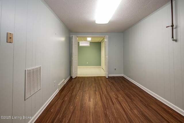 107 Westwood Dr, Elizabethtown, KY 42701 - empty room featuring wood finished floors, a textured ceiling, and ornamental molding