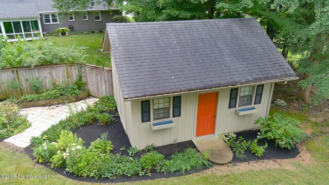 107 Westwood Dr, Elizabethtown, KY 42701 - view of front of home featuring board and batten siding, an outdoor structure, and roof with shingles