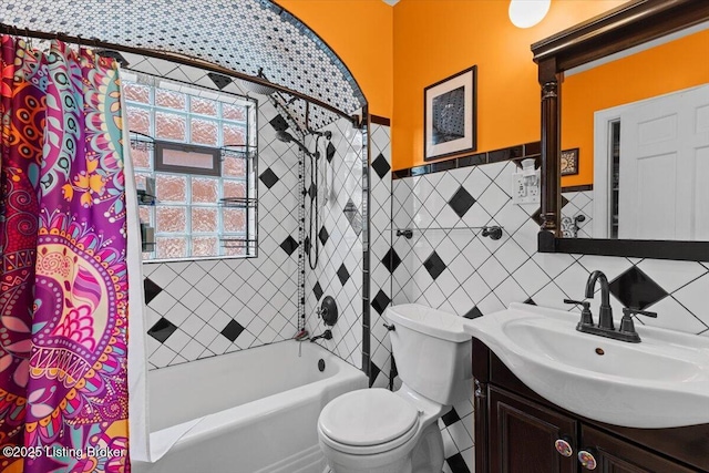 1120 Dresden Ave, Louisville, KY 40215 - bathroom featuring vanity, shower / bath combination with curtain, tile walls, and a wainscoted wall