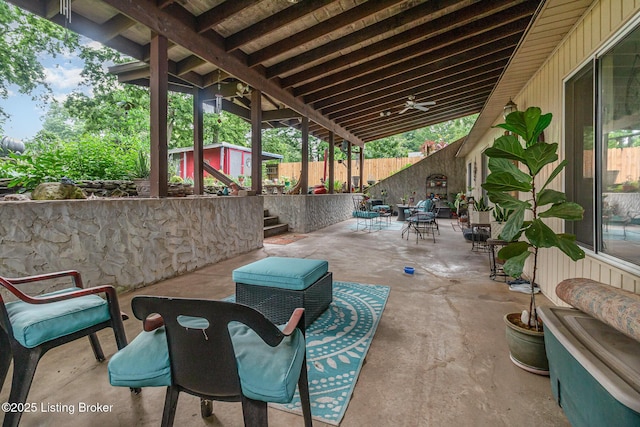 4906 Roman Dr, Louisville, KY 40291 - fenced backyard featuring a patio, a storage unit, and outdoor dining space