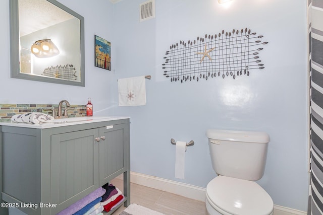 4906 Roman Dr, Louisville, KY 40291 - bathroom with vanity, tile patterned floors, and backsplash