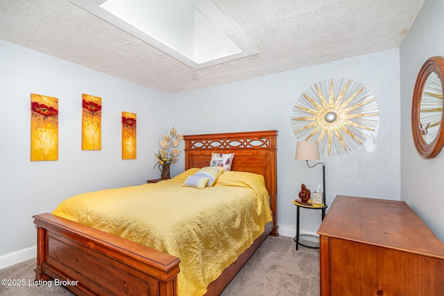 4906 Roman Dr, Louisville, KY 40291 - bedroom with a skylight, light carpet, and a textured ceiling