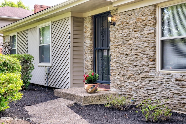 4606 Haeringdon Dr, Jeffersontown, KY 40299 - doorway to property with stone siding and a chimney