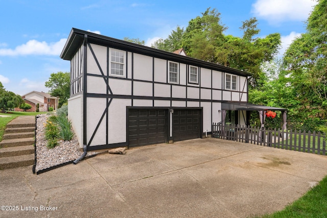 7813 Delightful Way, Louisville, KY 40291 - view of front of house featuring stucco siding, an attached garage, and concrete driveway