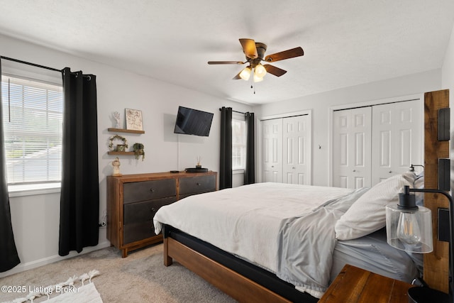 7813 Delightful Way, Louisville, KY 40291 - bedroom featuring two closets, light carpet, and a ceiling fan