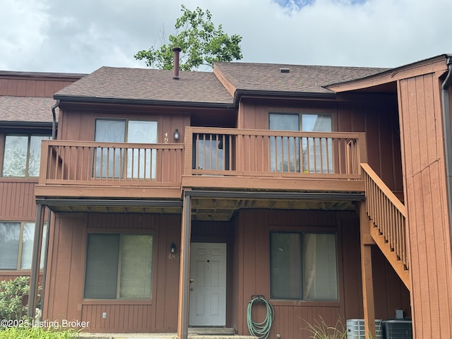 487 Piping Rock Rd, Brandenburg, KY 40108 - view of front of property featuring a balcony, a shingled roof, and stairs