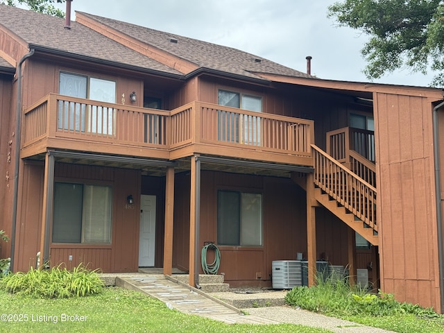 487 Piping Rock Rd, Brandenburg, KY 40108 - rear view of house with a shingled roof, stairs, and board and batten siding