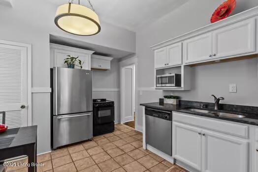 1129 S Brook St # 4, Louisville, KY 40203 - kitchen featuring stainless steel appliances, white cabinetry, hanging light fixtures, and light tile patterned floors