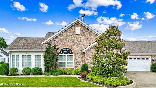 4331 Ivy Crest Cir, Louisville, KY 40241 - view of front facade with stone siding, concrete driveway, an attached garage, and a shingled roof