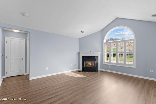 4331 Ivy Crest Cir, Louisville, KY 40241 - unfurnished living room featuring wood finished floors, vaulted ceiling, and a fireplace with flush hearth