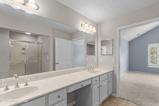4331 Ivy Crest Cir, Louisville, KY 40241 - full bath featuring double vanity, a stall shower, tile patterned floors, vaulted ceiling, and a textured ceiling